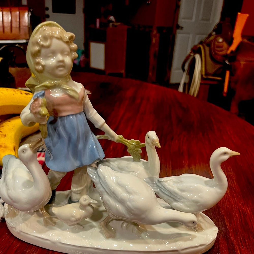 German girl with geese figurine.